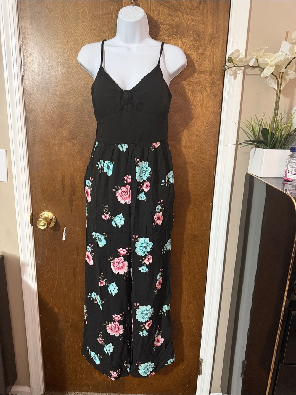 No Boundaries Black Floral Jumpsuit with Pink and Teal Flowers